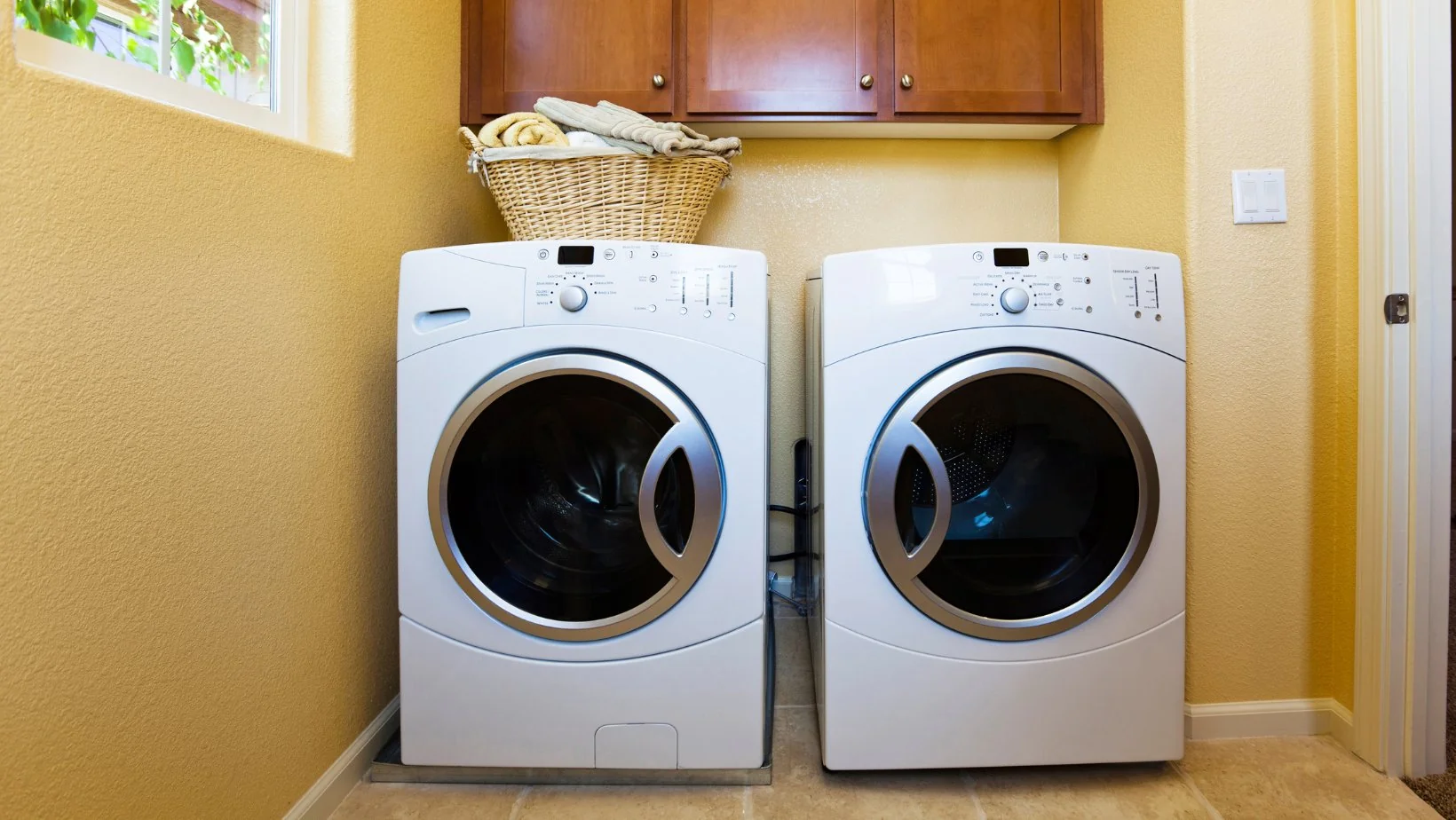 Front load washer and dryer in a laundry room - washer repair in Leander, TX