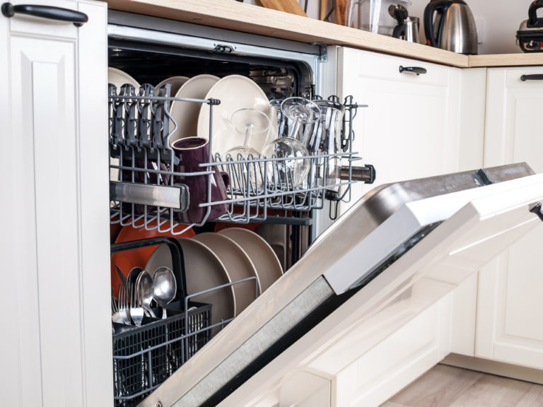 open dishwasher with dishes