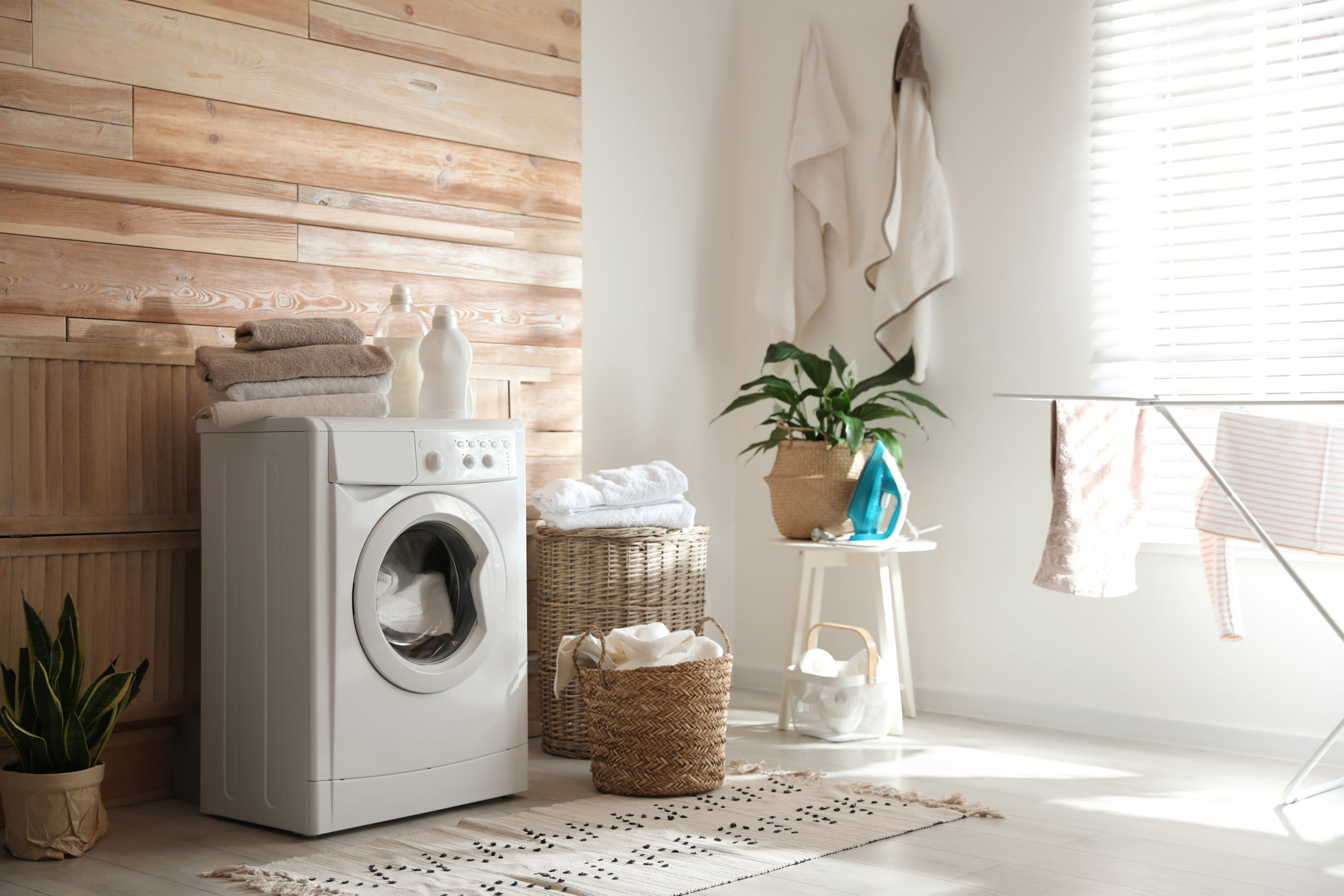 Stylish laundry room with modern washing machine