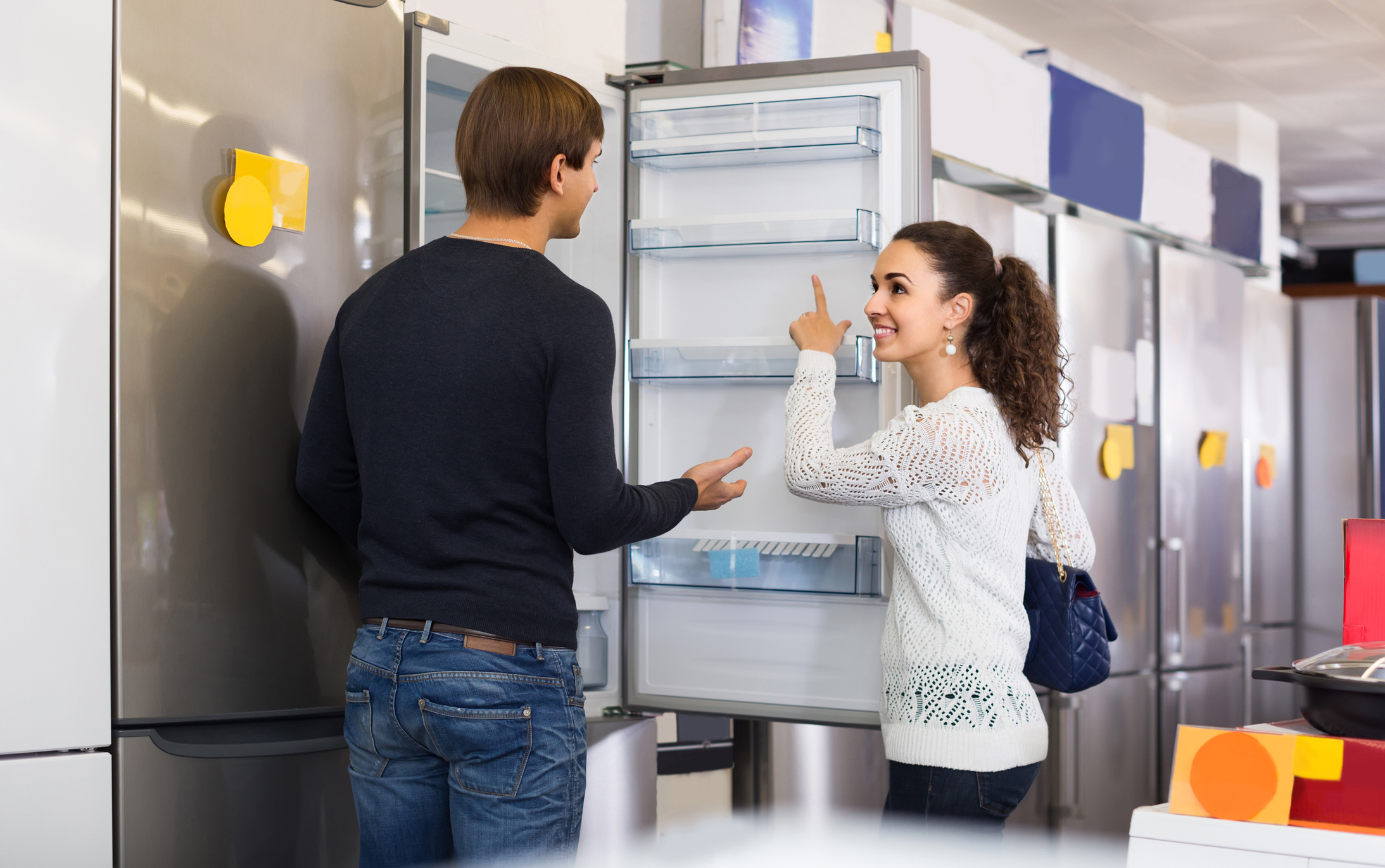 couple choosing new refrigerator