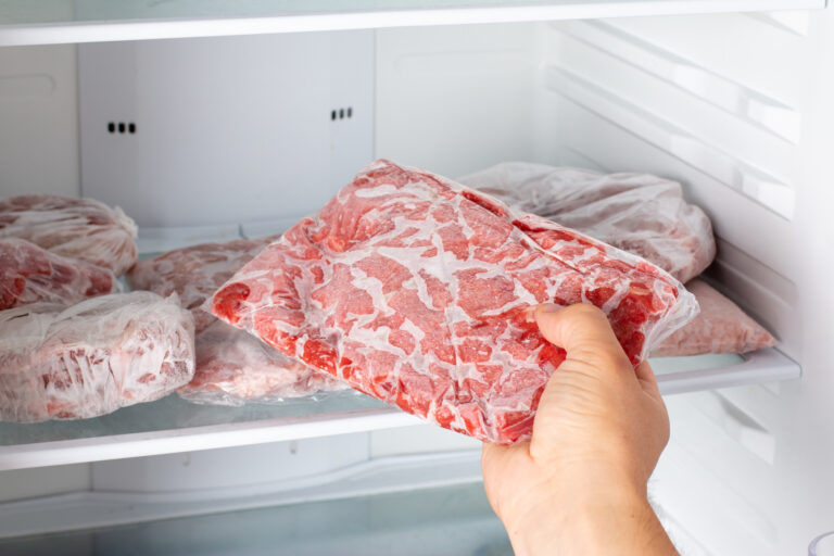 frozen hamburger being taken out of the freezer